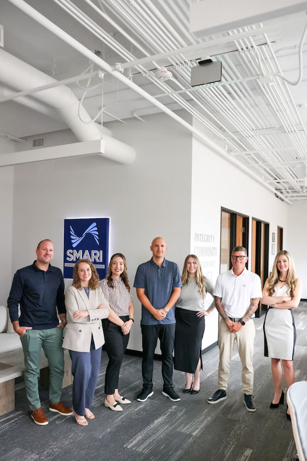7 SMARI team members posing in their office