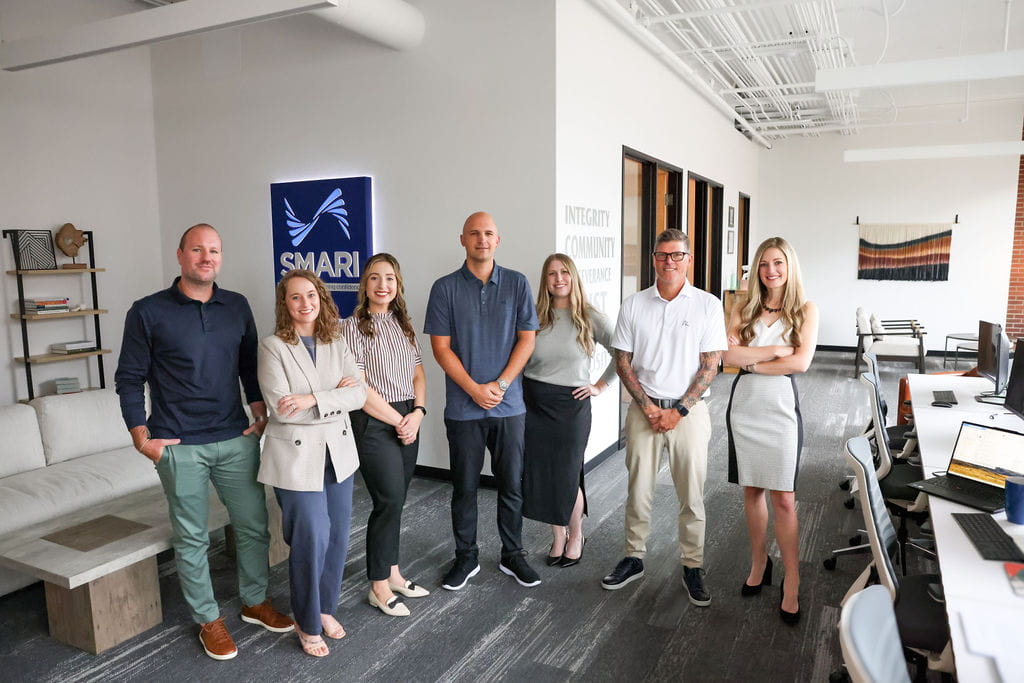 7 SMARI team members posing for a picture in the office