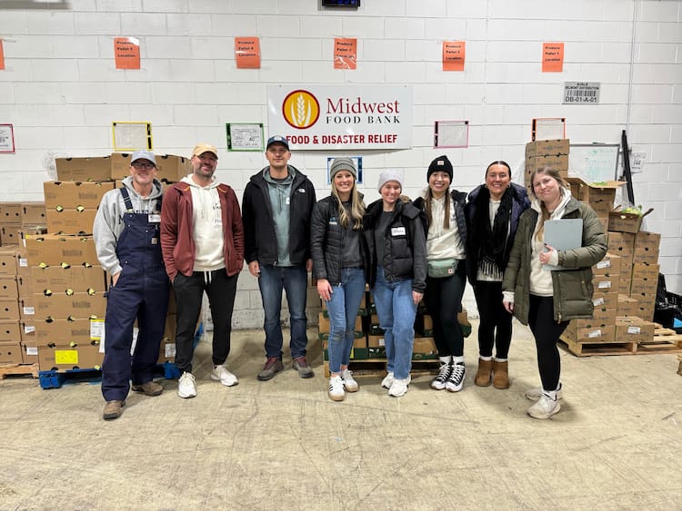 8 SMARI employees volunteering at Midwest Food Bank