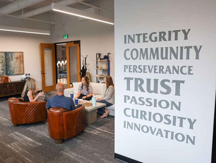 SMARI employees working from a lounge area in their office